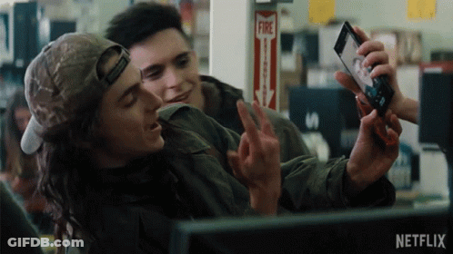 Man Taking Selfie With Another Man In Front Of Fire Alarm GIF