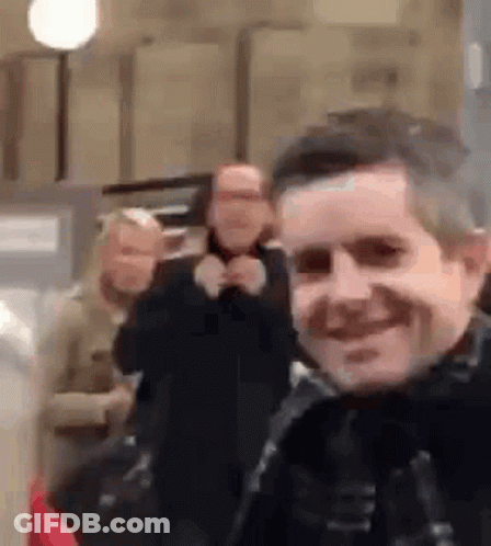 Man Taking Selfie With Group Of People GIF