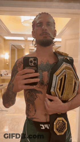 Man Taking Selfie With UFC Belt GIF