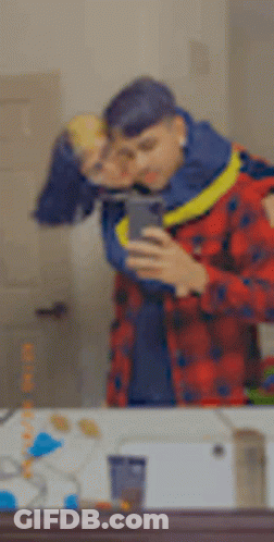 Man Taking Selfie With Woman In Mirror GIF