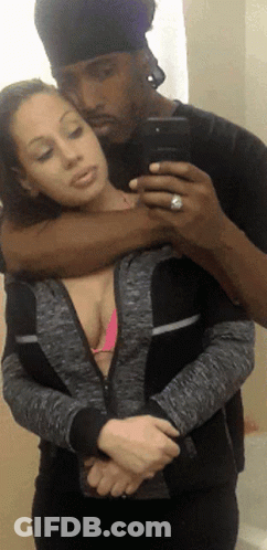 Man Taking Selfie With Woman In Pink Bikini GIF