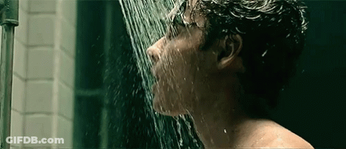 Man Taking Shower With Water Coming Out Of Mouth GIF