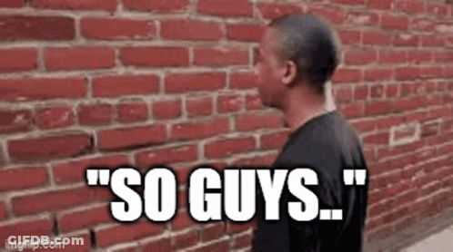 Man Talking By Brick Wall GIF