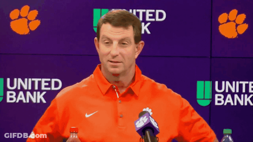 Man Talking In Front Of United Bank Sign GIF