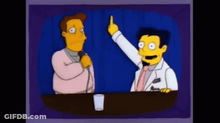 Man Talking Into Microphone Another Pointing GIF