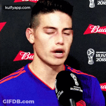 Man Talking Into Microphone Eyes Closed GIF