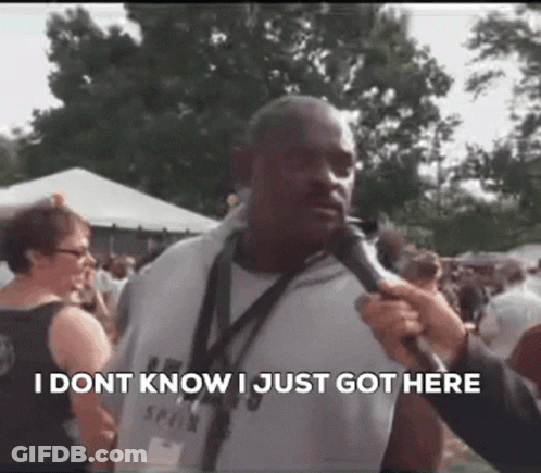 Man Talking Into Microphone In Crowd GIF