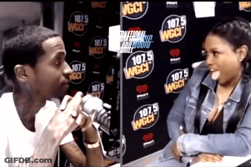 Man Talking Into Microphone In Front Of 107.5 Wall GIF