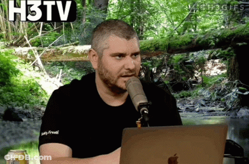Man Talking Into Microphone In Front Of Apple Laptop GIF