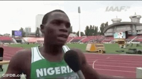 Man Talking Into Microphone On Track In Nigerian Jersey GIF