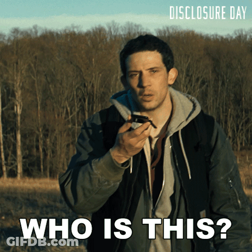 Man Talking Into Microphone Saying Who Is This GIF