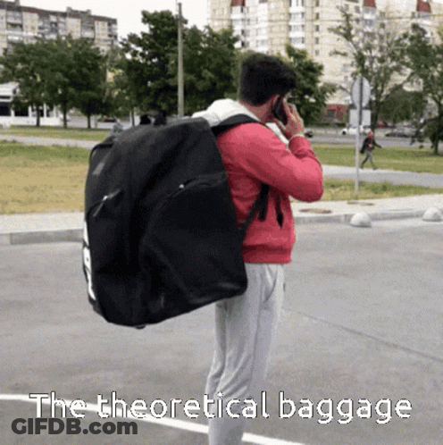 Man Talking On Cell Phone Carrying Theoretical Baggage GIF