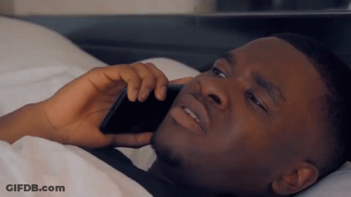 Man Talking On Cell Phone In Bed GIF