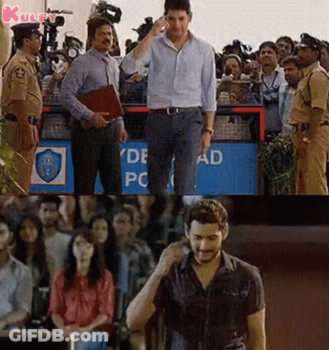 Man Talking On Cell Phone In Front Of Crowd GIF
