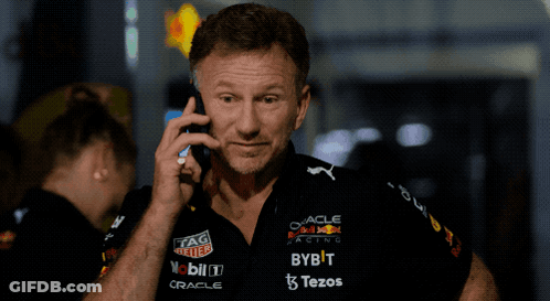Man Talking On Cell Phone In Red Bull Racing Shirt GIF