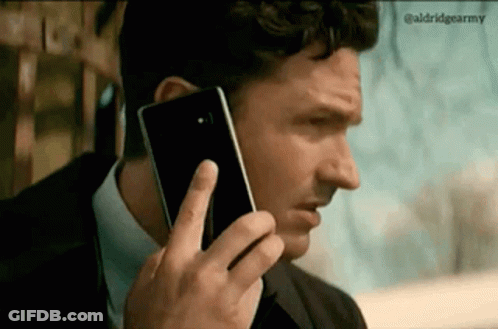 Man Talking On Cell Phone In Suit GIF
