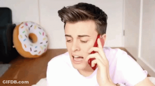 Man Talking On Cell Phone With Doughnut Pillow GIF