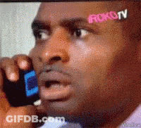 Man Talking On Cell Phone With Roku TV Sticker On Forehead GIF
