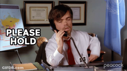 Man Talking On Phone Saying Please Hold GIF