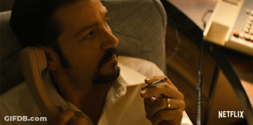 Man Talking On Phone With Netflix Logo GIF