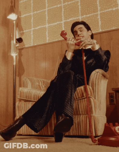 Man Talking On Red Phone GIF