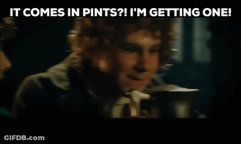 Man Talking To Another Man Holding Coffee In Dark Room GIF