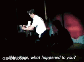 Man Talking To Another Man On Stage GIF