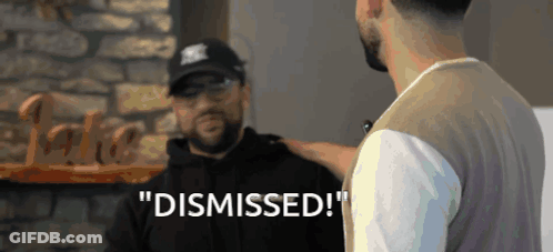 Man Talking To Another Man Saying Dismissed GIF