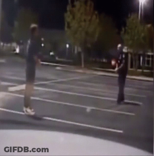 Man Talking To Police Officer In Parking Lot GIF