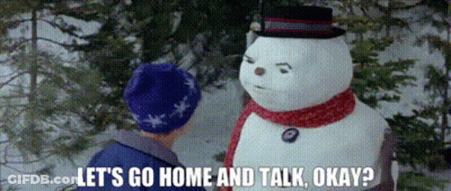 Man Talking To Snowman In Snow GIF