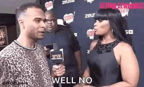 Man Talking To Woman Holding Microphone GIF