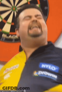 Man Throwing Dart At Unicorn Dartboard GIF