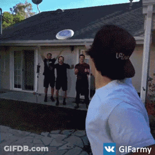 Man Throwing Frisbee In Front Of House GIF