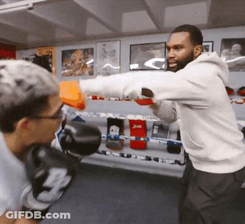 Man Throwing Punch In Boxing Gloves With Letter B GIF