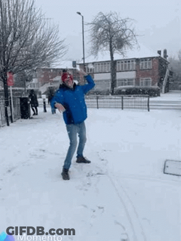 Man Throwing Snowball In Air GIF