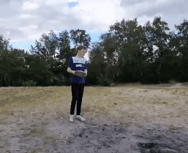 Man Throws Frisbee Far GIF