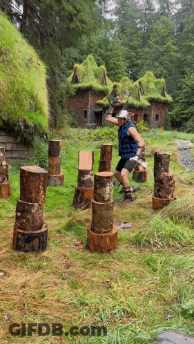 Man Throws Log In Field GIF