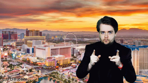Man Thumbs Up In Front Of City At Sunset GIF