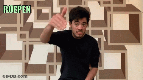 Man Thumbs Up In Front Of Roepen Wall GIF