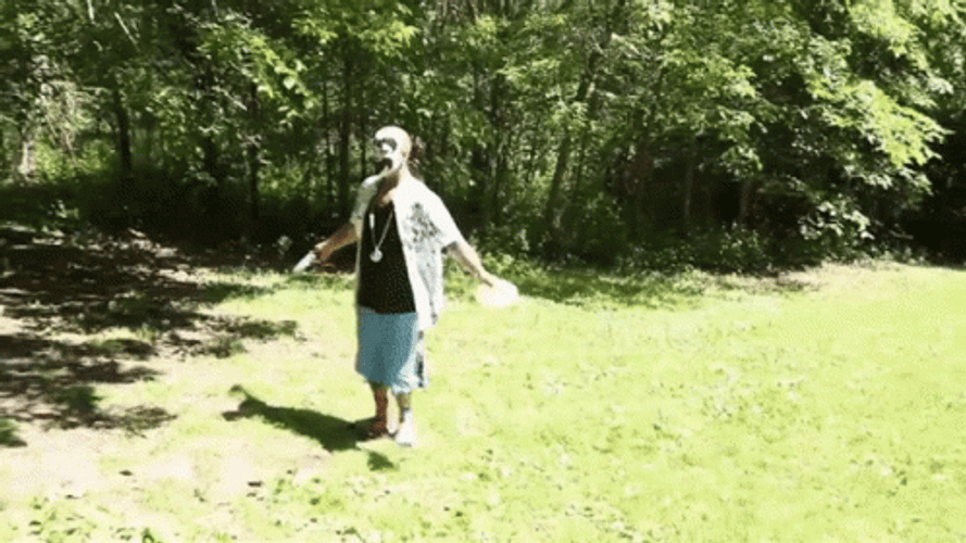 Man Tosses Frisbee GIF