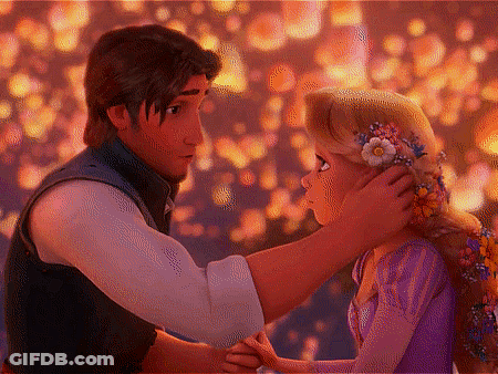 Man Touching Girl's Hair With Flower Crown GIF