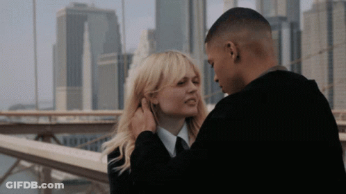 Man Touching Woman's Ear GIF