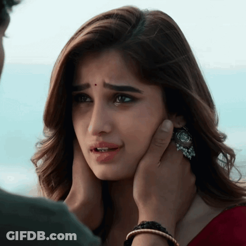 Man Touching Woman's Face GIF