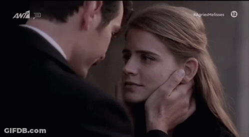Man Touching Woman's Face GIF