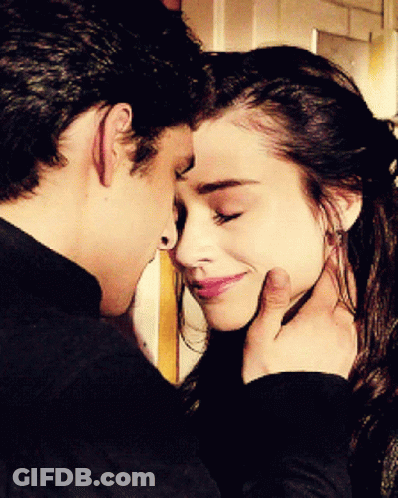 Man Touching Woman's Face GIF