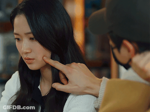 Man Touching Woman's Face While Wearing Mask GIF