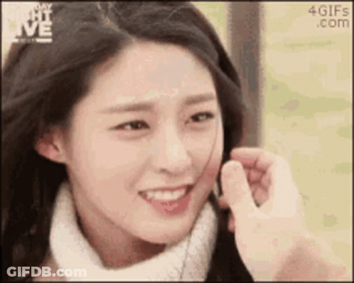 Man Touching Woman's Face With Finger GIF