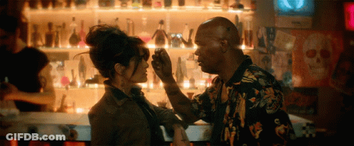 Man Touching Woman's Forehead At Bar GIF