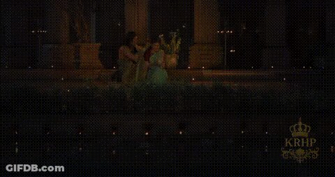 Man Touching Woman's Hair In Dark Room GIF