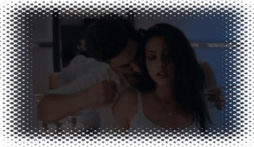 Man Touching Woman's Shoulder In Dark Room GIF